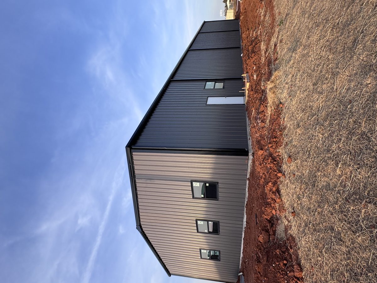 Charcoal metal building golden hour Oklahoma