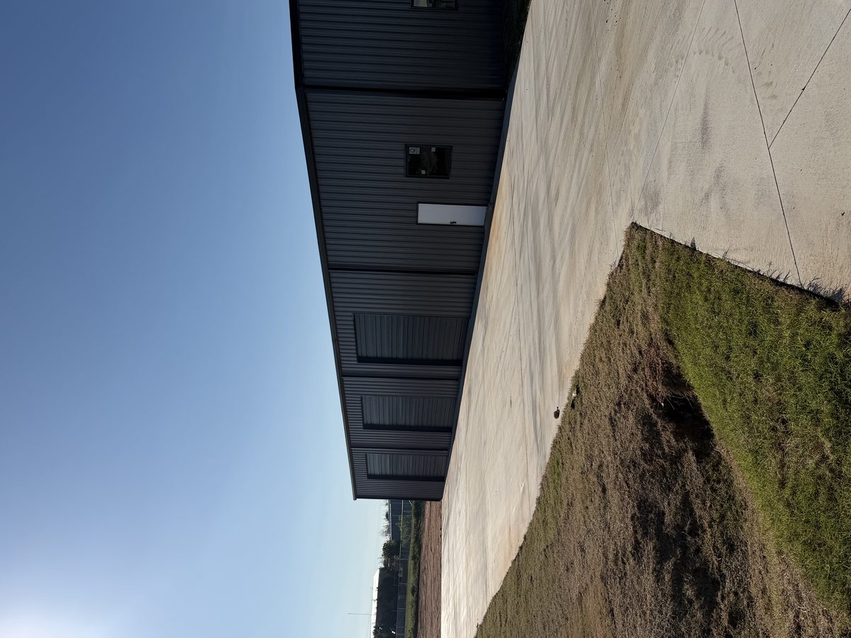 Commercial metal building with concrete apron